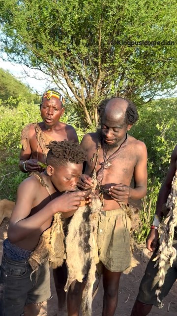 Members of the Hadzabe eating breakfast
